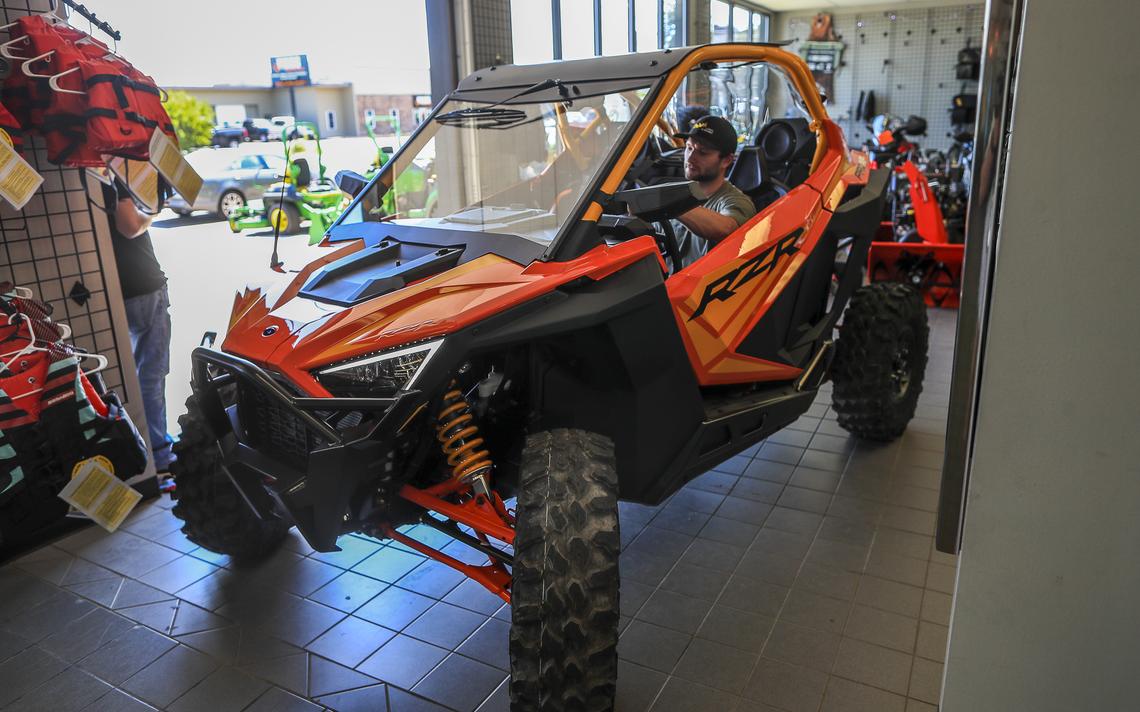 Duluth Lawn & Sport employee Chris Gassert of Moose Lake maneuvers a Polaris RZR Pro XP side-by-side ATV Thursday in a tight area of the showroom while preparing to deliver the vehicle to a customer in Two Harbors. (Clint Austin / caustin@duluthnews.com) 