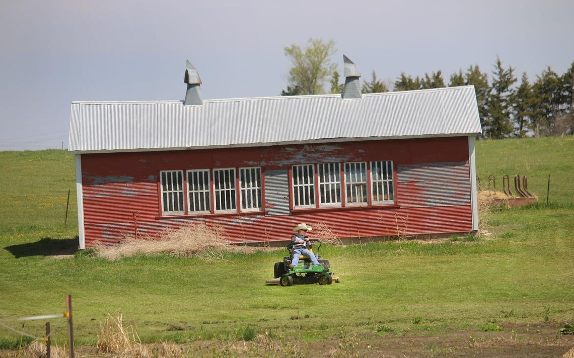 Jack Saienga, 10, mows like a pro on the farmstead of his parents, John and Amber Saienga, Miller, S.D. The kids works harder than many adults but aren’t yet old enough to take an all adult farm labor, says their proud dad. Photo taken May 15, 2020, near Miller, S.D. Mikkel Pates / Agweek 