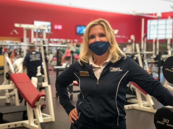 Linda Rackner with PRO Club in Bellevue, Wash., says the enormous, upscale gym has adapted relatively easily to the new coronavirus rules. The fitness club's physical size, extensive budget and technology have helped staffers maintain a fairly normal experience for their members.