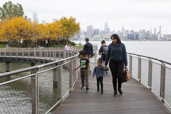 Sabrina Castillo walks with her children Lorenzo, 5, and Camila, 3, in Hoboken, N.J. "If one parent has to be home, it's probably going to be — in our culture — it's going to be ... the mother," Castillo said.