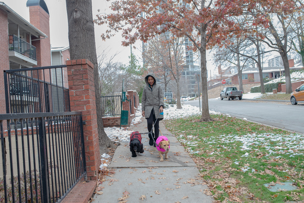 Jaleesa Garland walks her dogs around her new Tulsa neighborhood.