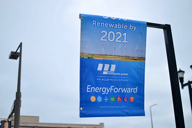 Signs hang in downtown Duluth promoting Minnesota Power's goal to produce 50 percent of its energy from renewable resources by 2021.