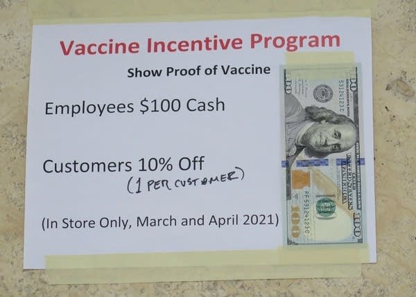 A sign outlining vaccine incentives. 