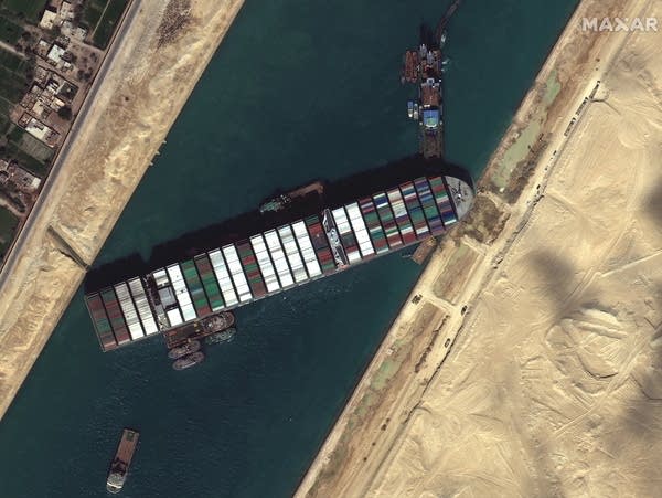 A satellite image of a ship stuck in a canal