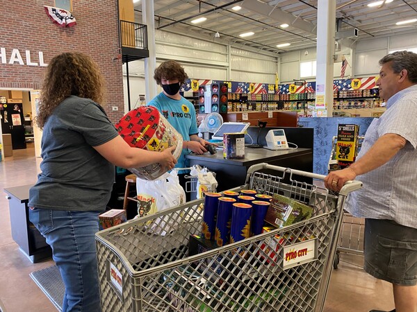 Donna Nuccio (left), store manager at Pyro City store near Lone Jack, Mo., assists a customer.