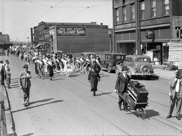 Miners and steel workers parade through Farrell, Pa., on May 1, 1937, to celebrate the upholding of the Wagner Act which protects workers' rights to form and join unions.