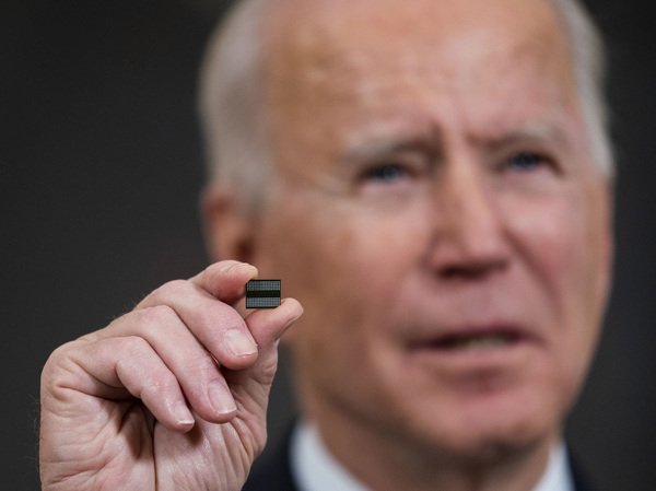 President Biden holds a chip during remarks before signing an executive order on the economy  on Feb. 24. The Biden administration is taking steps to try to improve the supply of semiconductors in the United States.