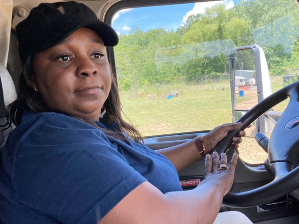 Williams demonstrates how to drive a truck at the DSC Training Academy on June 29. The teaching includes explaining the two types of airhorns used by trucks.