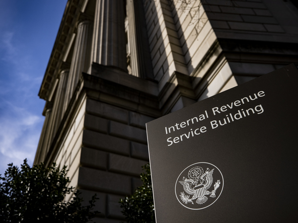 Signage outside the IRS headquarters in Washington, D.C., is shown on March 19. The IRS' plan on bank accounts would require lenders to report the annual total of deposits and withdrawals, not individual transactions.