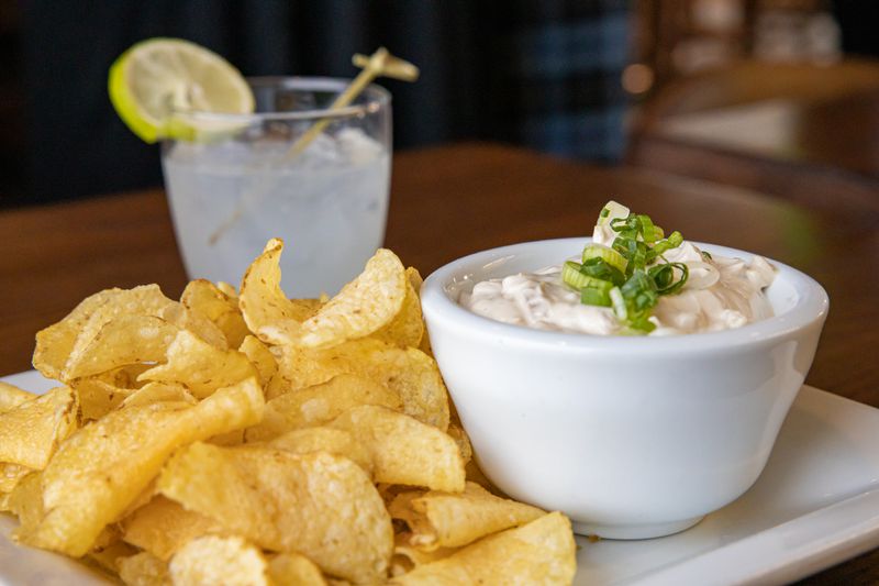 A photo of a cocktail, chips and dip at The Cocktail Room at 18th&nbsp;and Central.