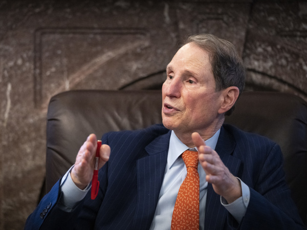 Sen. Ron Wyden, D-Oregon, speaks to reporters about a corporate minimum tax plan at the U.S. Capitol on Oct. 26 in Washington, D.C. Wyden feuded with Tesla CEO Elon Musk over the senator's proposal to tax stock investments held by billionaires annually.
