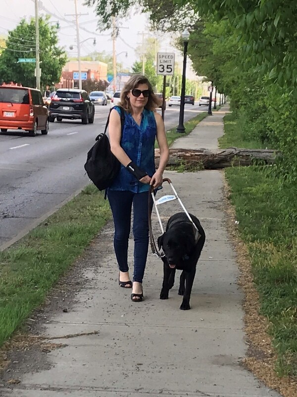 Heather Leiterman walks with her guide dog. When she was at an airport, an agent with the Transportation Security Administration insisted she take off the dog's leash, harness and collar, even though that would mean she would lose control of the service animal.