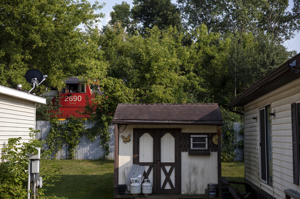 A train passes right behind Mary Hunt's home on Wednesday, Aug. 4, 2021 in Swartz Creek, Mich.