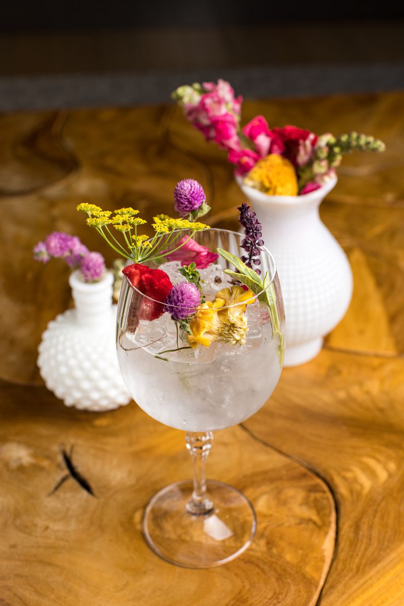 A flower-filled gin and tonic goblet.