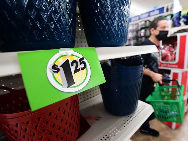 A sign displaying a $1.25 price tag is posted on the shelves of a Dollar Tree store in Alhambra, Calif, on Dec. 10, 2021. The store is known for its $1 items, but it was forced to raise many prices to $1.25 because of high inflation.