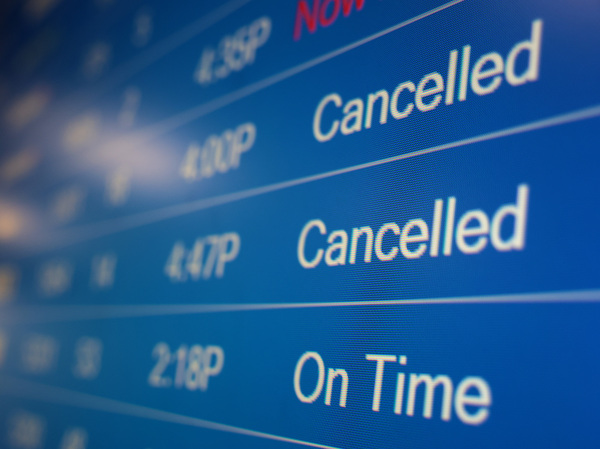 A flight information display system shows cancelled flights at the Ronald Reagan Washington National Airport on Dec. 27, 2021, in Arlington, Va. Flight cancellations became a regular occurrence in December as the omicron variant infected staff at airports and airlines.