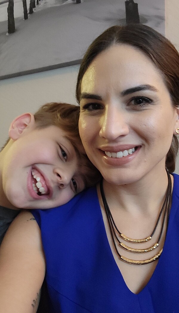 Sarah Ahmed and her 9-year-old son, Alex, at their apartment in Tampa, Florida. Ahmed got stuck paying more than $2,000 in interest on a $2,300 loan from an online lender. Consumer groups want the FDIC to stop these "rent-a-bank" loans.