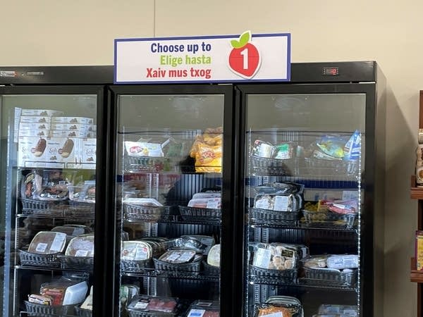 A refrigerator freezer display stores food 