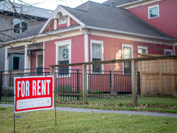 A 'For Rent' sign is posted near a home in Houston on Feb. 7 in Houston. Housing costs have been surging, contributing to high inflation.