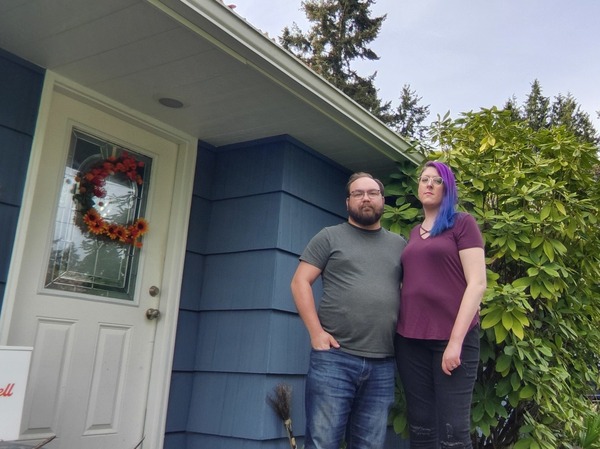 Alex Bacon and her husband, Eli Leslie, at their current house, which is very close to Seattle's airport. "I'm just off the end of one of the runways, so the air just smells of jet fuel," she says. The couple is scrambling to find a house to buy before mortgage rates go much higher.