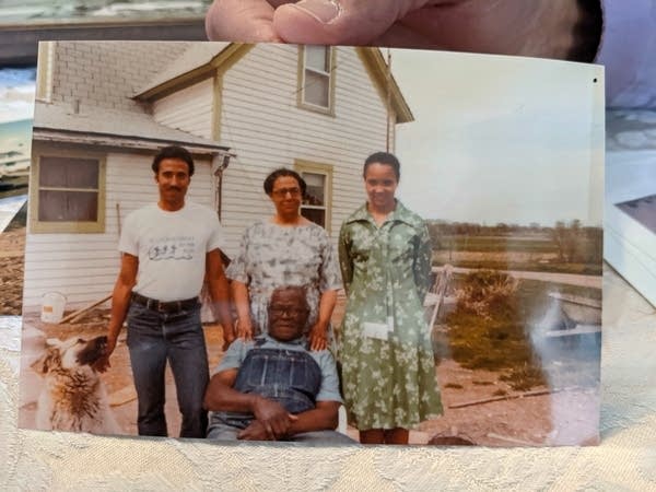 An old photo of a family on a farm