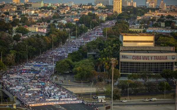 Thousands file through an avenue during a May Day march to Revolution Square in Havana, Cuba, on Sunday.