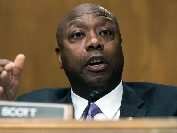 Sen. Tim Scott, R-S.C., speaks as Treasury Secretary Janet Yellen testifies before a Senate committee hearing May 10. He told her it was "harsh" to talk about abortion access as an economic issue for women. "As a guy raised by a Black woman in abject poverty, I'm thankful to be here," he said.