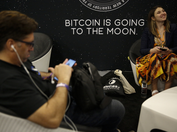 A sign that reads "Bitcoin is going to the moon" is seen during the Bitcoin 2022 Conference at Miami Beach Convention Center in Miami on April 8. The expression has become popular among some Bitcoin enthusiasts.