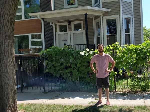Bashir Nuruddin in front of one of the buildings he owns and rents out in Chicago. When an apartment came open recently, he says, "I had so many phone calls that I just stopped answering."