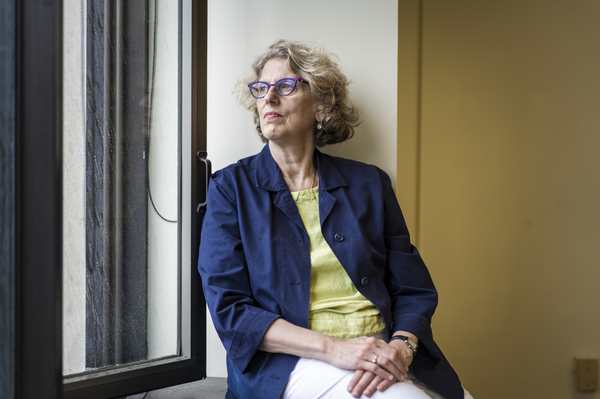 Juliet Schor, an economist and sociology professor, sits for a portrait at her office at Boston College on June 27, 2022.