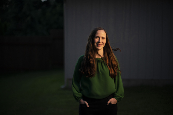 Cati Bennett, a chaplain resident in the VA health care system in Portland, Ore., stands in her backyard in Vancouver, Wash., on June 23. She became a hospital chaplain during the pandemic.