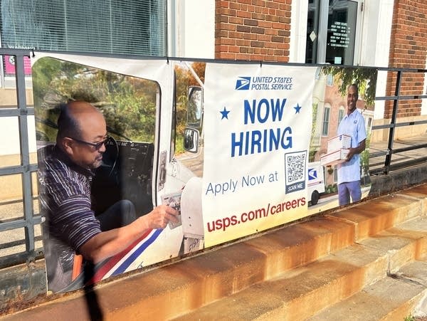 A banner that says "Now Hiring"