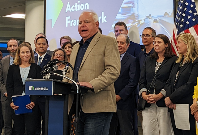 On Friday, Gov. Tim Walz, center, unveiled a “Climate Action Framework” that details policy hopes held by Democrats, climate nonprofits and some businesses to reduce carbon emissions across the state.