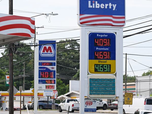 Gas prices are down from recent highs, but risks to the supply chain threaten to raise costs for consumers again. Above, station prices are seen in Bethesda, Md., on Aug. 11.