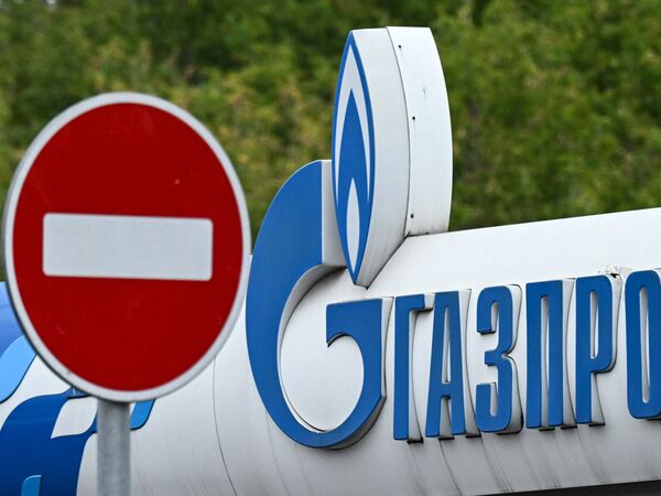 Russia reduced natural gas supplies to Europe after the West imposed sanctions, leading to higher global prices for natural gas. Here, the logo of Russia's energy giant Gazprom is displayed at a petrol station in Moscow in September.