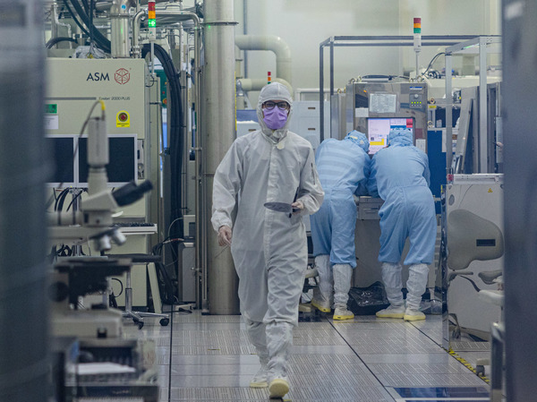 A student wears cleanroom suit conducts a research inside the clean room of Taiwan Semiconductor Research Institution during a press semiconductor tour at Hsinchu Science Park on September 16, 2022 in Hsinchu, Taiwan.