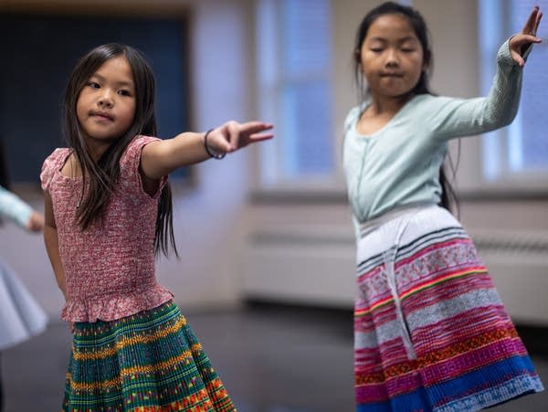 Girls practice traditional dance moves
