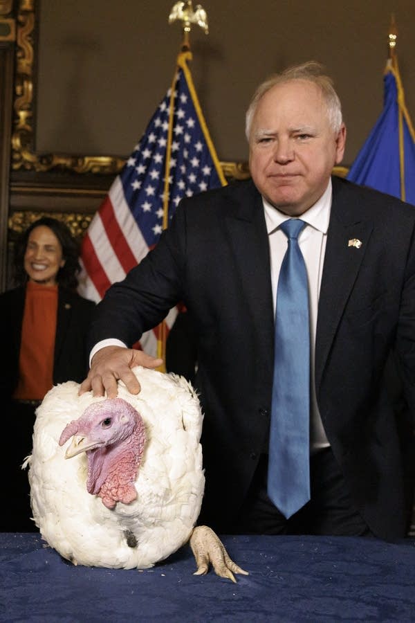 Tim Walz poses with a Thanksgiving turkey