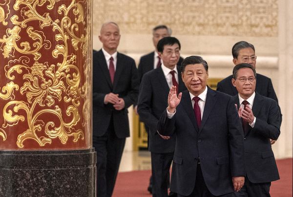 Chinese President Xi Jinping and his new Politburo Standing Committee members arrive for a group photo at The Great Hall of People in Beijing on Oct. 23.