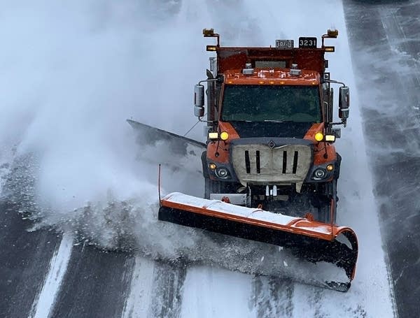 A snow plow on the road