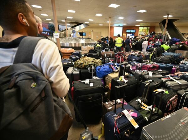 Newly arrived Southwest Airlines passengers wait for their luggage to arrive at Hollywood Burbank Airport in Burbank, Calif., on Tuesday.