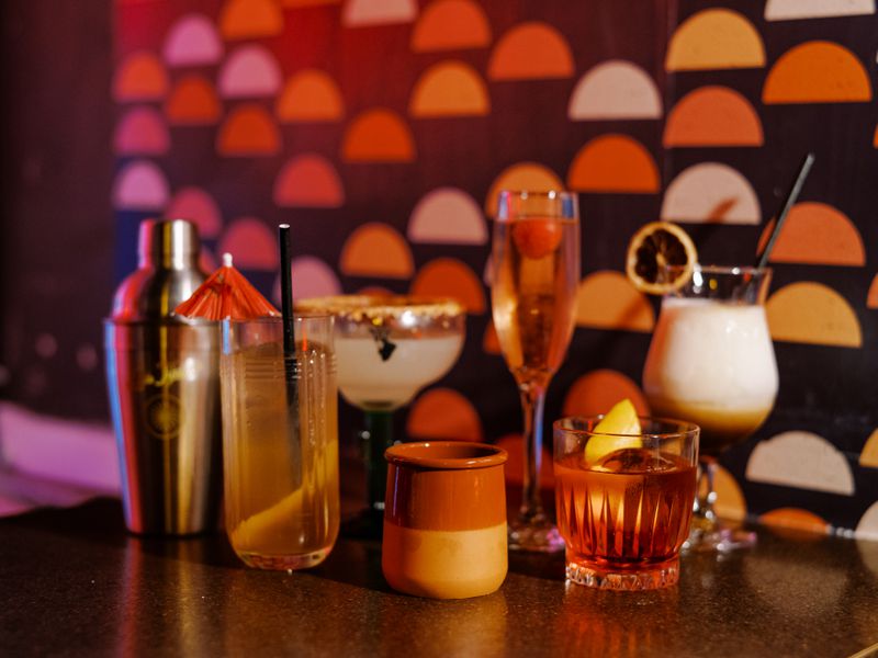 An assortment of cocktails on a table. 