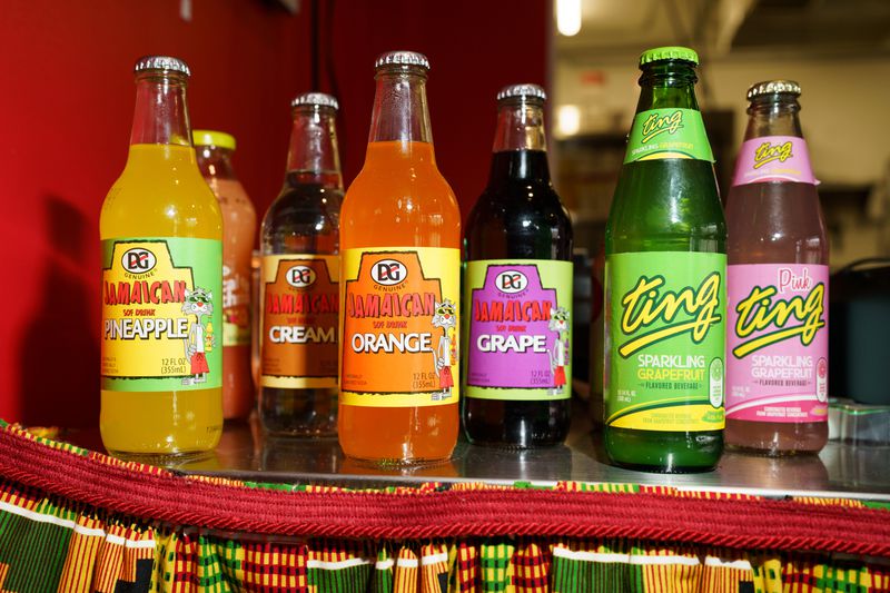 An array of colorful Jamaican sodas on a counter. 