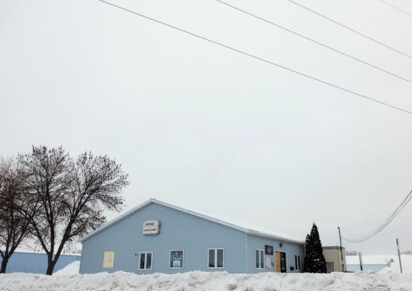 The exterior of a blue building in the winter