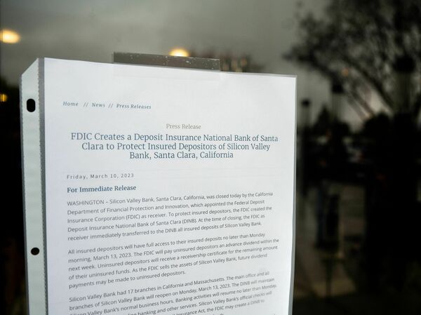 A notice informing of Silicon Valley Bank's closure hangs at the bank's headquarters in Santa Clara, California on March 10, 2023. The bank suffered a swift demise after fears of its financial health led to a rush of depositors looking to withdraw their funds.
