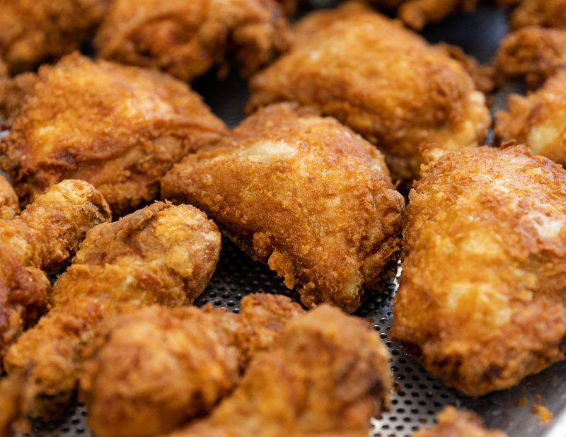 An assortment of fried chicken pieces. 