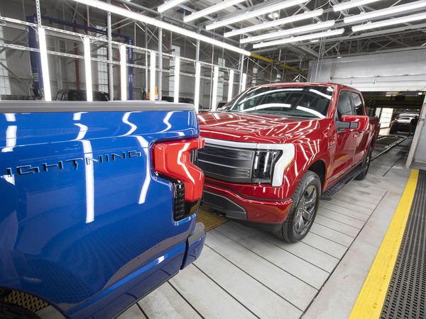 Ford F-150 Lightning pickup trucks are shown at the Ford Rouge Electric Vehicle Center in Dearborn, Michigan, on April 26, 2022. The Lightning should still qualify for the full $7,500 tax credit, but it also depends on other criteria including the sticker price of the vehicle and the buyer's income.