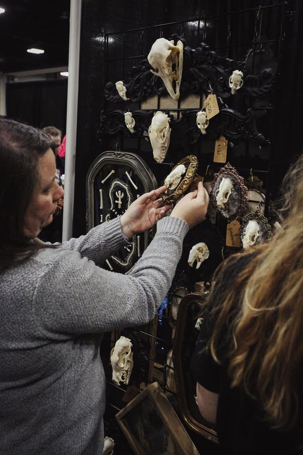 People attend an expo featuring gothic and dark-fantasy items