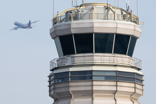 An American Airlines Airbus A319 airplane takes off past the air traffic control tower at Ronald Reagan Washington National Airport in Arlington, Va., in January.
