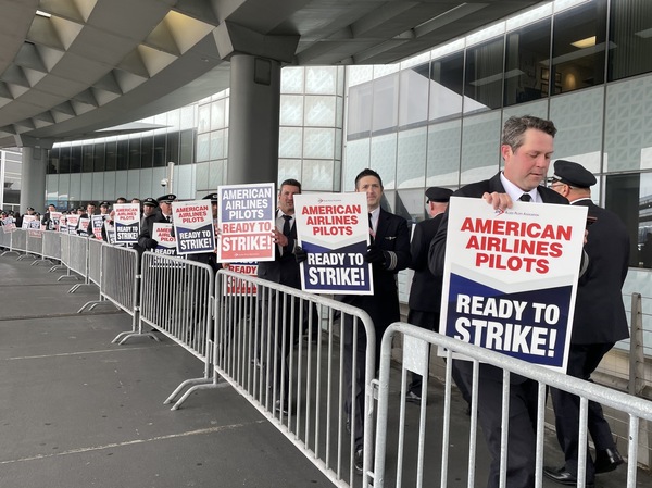 American Airlines pilots picket outside Chicago O'Hare airport on May 1, 2023, after voting to authorize a strike. They are now close to a deal that would give them substantial raises and quality of life improvements.